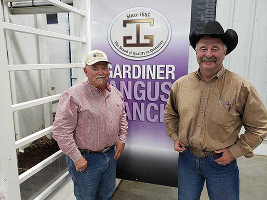 Two men, Gardiner Angus Ranch