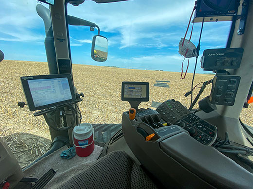 Inside of tractor showing automated guidance equipment