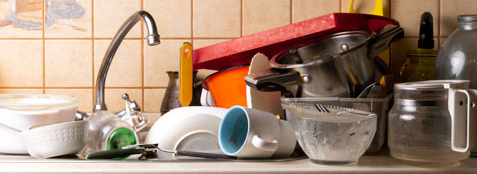 A dirty kitchen sink. A dirty kitchen sink.