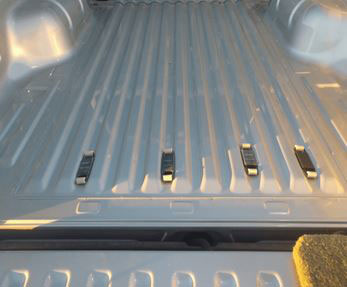 Image of truck bed with RollBedder rollers installed