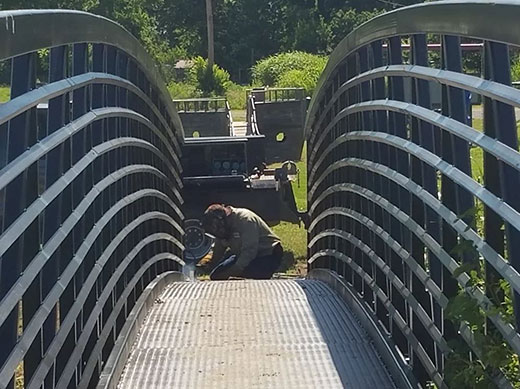 Man welding metal bridge Man welding metal bridge
