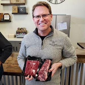 Dave Dreiling holding packaged wagyu beef cuts