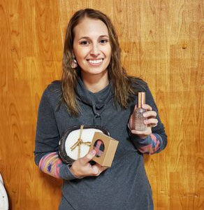 Woman holding soap and other products
