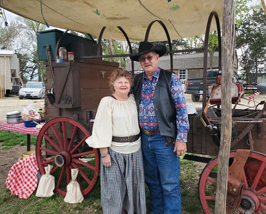 Woman and man standing in front of Chuckwagon Barbecue
