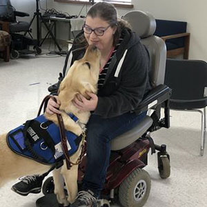 Corwin, an assistance dog, with Angela