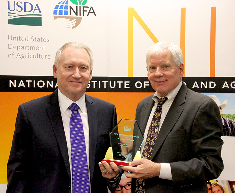 Dan Devlin, Great Plains Grazing project leader and director of the Kansas Center for Agricultural Resources and the Environment, and J. Scott Angle, director of NIFA, at the annual NIFA Partnership Awards in Washington, D.C. on April 25.