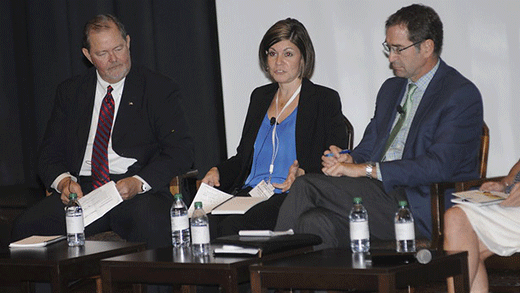 Three people sitting on stage, livestock sustainability panel Three people sitting on stage, livestock sustainability panel