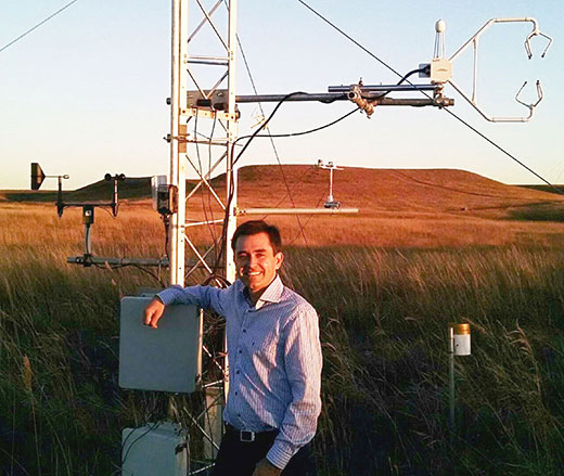 Eduardo Santos, man standing in front of flux tower
