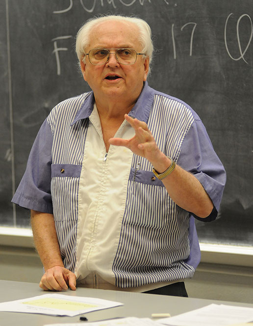 Barry Flinchbaugh, teaching in front of chalkboard