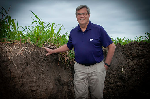 Chuck Rice standing in a soil pit