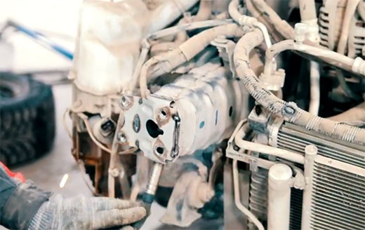 Hands of man workin gon heating element Hands of man working on heating element