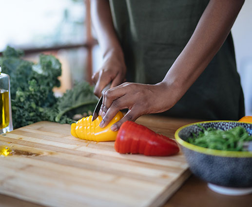 Closeup of woman's hands cutting vegetables Closeup of woman's hands cutting vegetables