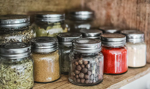Jars of food sitting on a shelf