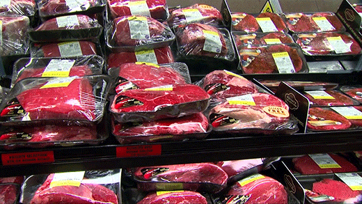 packaged steaks on grocery store shelf
