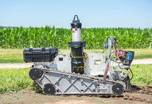 Small robotic vehicle with sprayer, camera and computer monitor