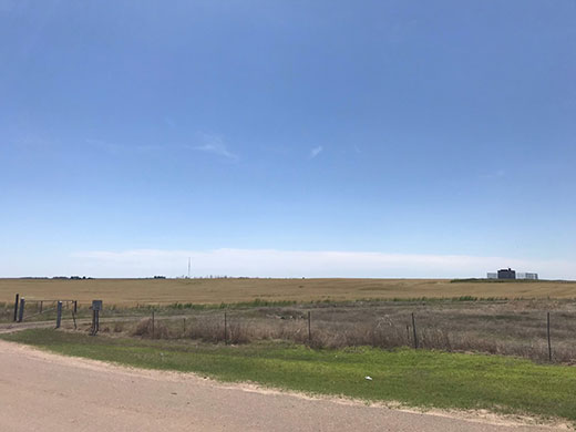 Open land surrounded by fence Open land surrounded by fence
