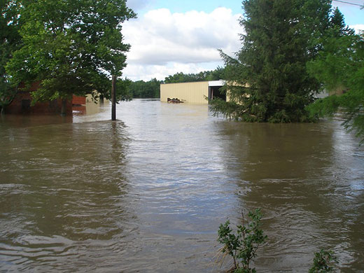 Floodwater surrounding barn and business Floodwater surrounding barn and business