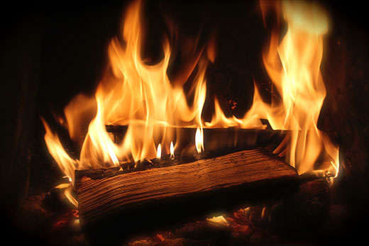 firewood burning in a fireplace