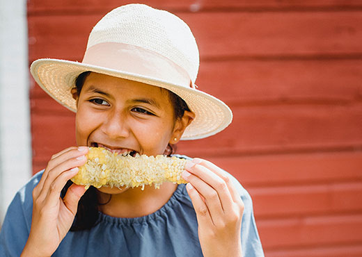 Child eating sweet corn