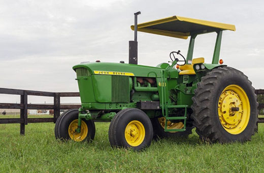 Green tractor with rollover protection kit installed
