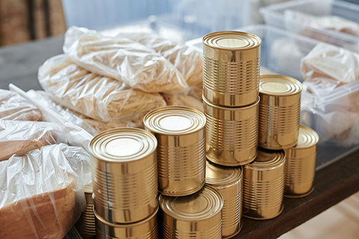 cans without labels stacked on a table