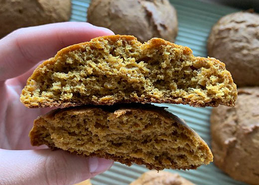 closeup, hand holding two muffin tops closeup, hand holding two muffin tops