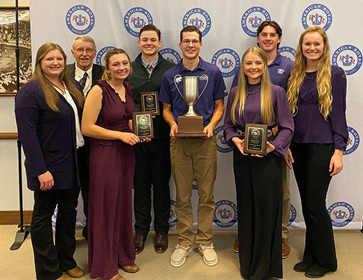 Group photo, K-State crops judging team, with trophies