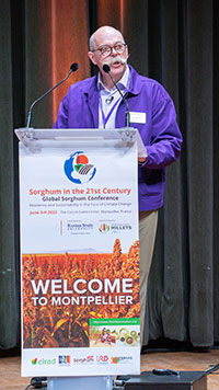 Ernie Minton speaking at podium at Global Sorghum Conference